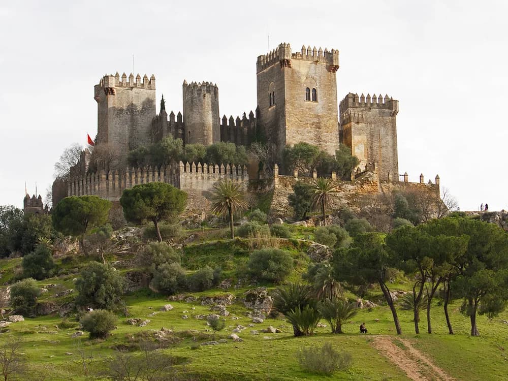 Almodóvar Castle's nine towers crowning a hill above the Guadalquivir valley in Andalusia, Spain