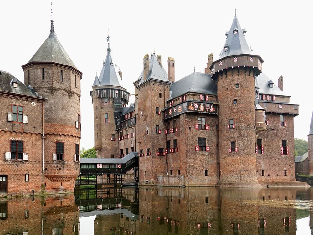 De Haar Castle with its 12 towers reflected in the surrounding moat, Utrecht Province, Netherlands