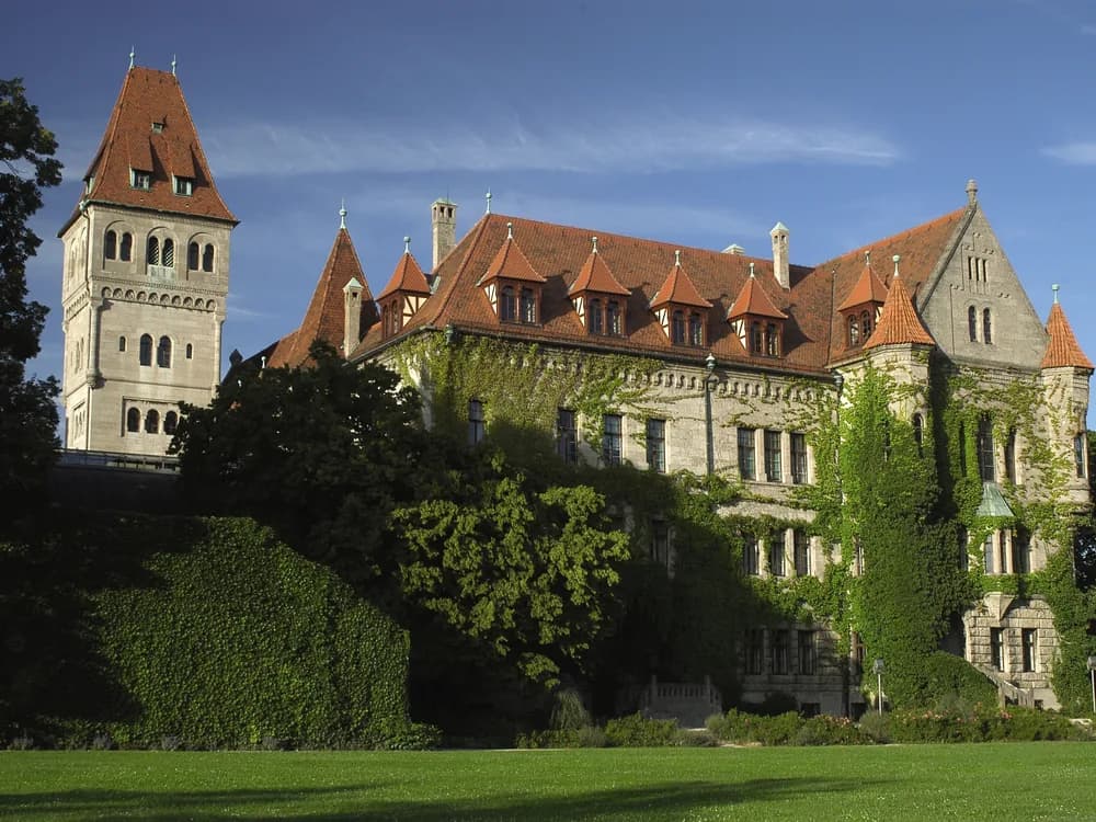 The neo-Gothic towers of Schloss Faber-Castell above the River Rednitz in Stein, Bavaria