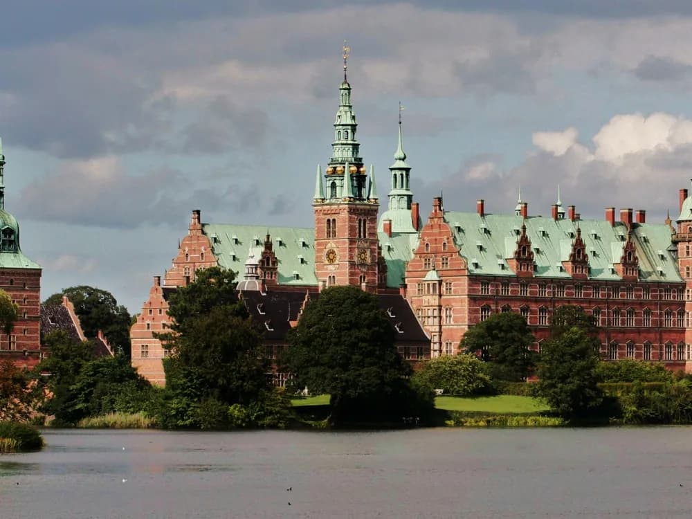 Frederiksborg Palace Dutch Renaissance towers reflected in the lake at Hillerød, Denmark