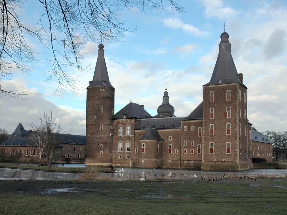 Hoensbroek Castle reflected in its double water moat in South Limburg, Netherlands