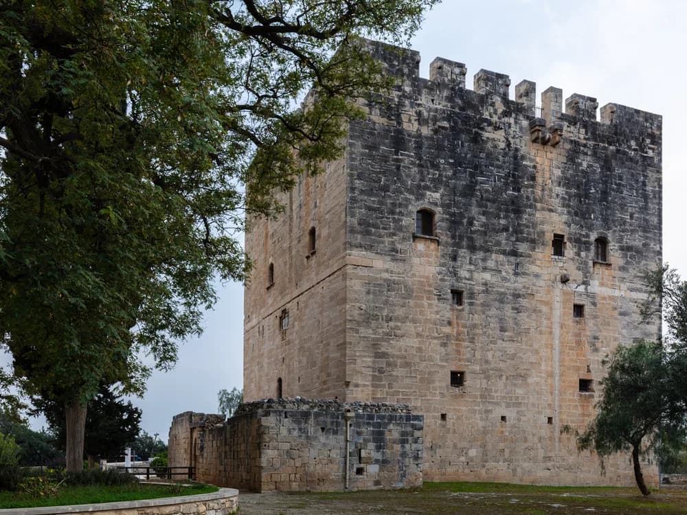 Kolossi Crusader Castle golden limestone tower rising from citrus groves in Cyprus