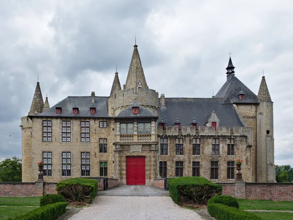 Laarne Castle reflected in its water moat, East Flanders, Belgium
