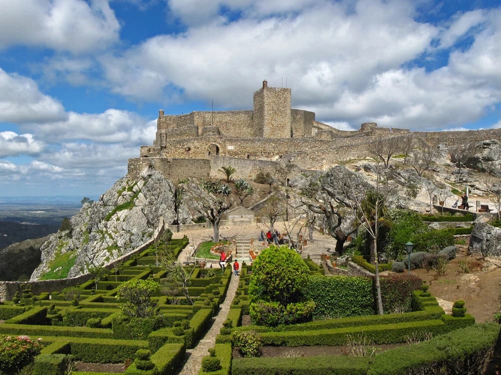 Marvão Castle on its granite clifftop spur at 900 metres, with the Alentejo plain stretching to the horizon