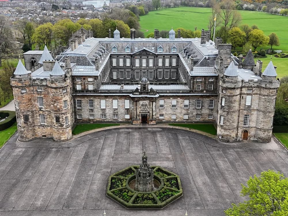The Palace of Holyroodhouse with the ruined Holyrood Abbey nave in its forecourt, Edinburgh