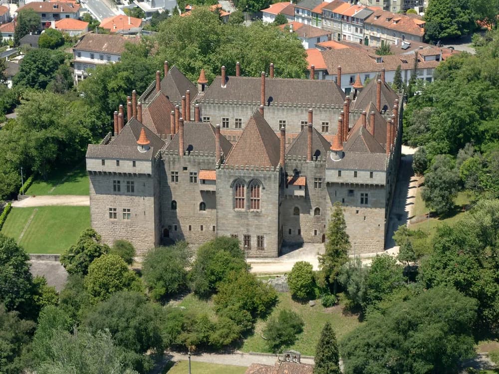 The Palace of the Dukes of Braganza's 39 cylindrical chimneys above the rooftops of Guimarães