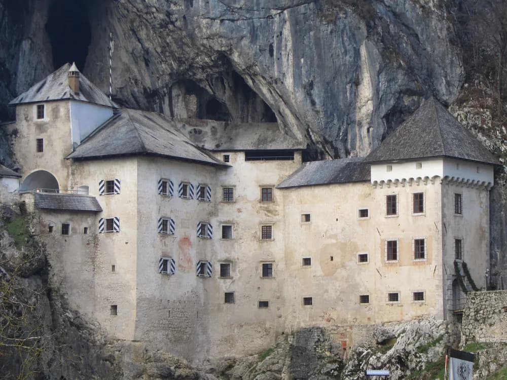 Predjama Castle built into the mouth of a limestone cave in the Karst hills of Slovenia