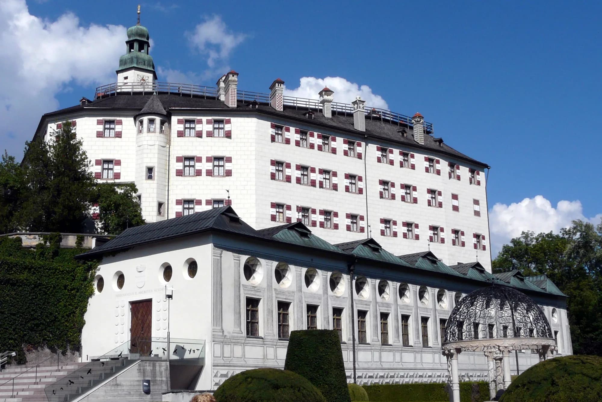 Schloss Ambras on its forested hill above Innsbruck, Tyrol, Austria