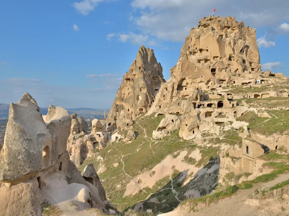 Üçhisar Castle rock pinnacle rising above Cappadocia at sunrise in Turkey