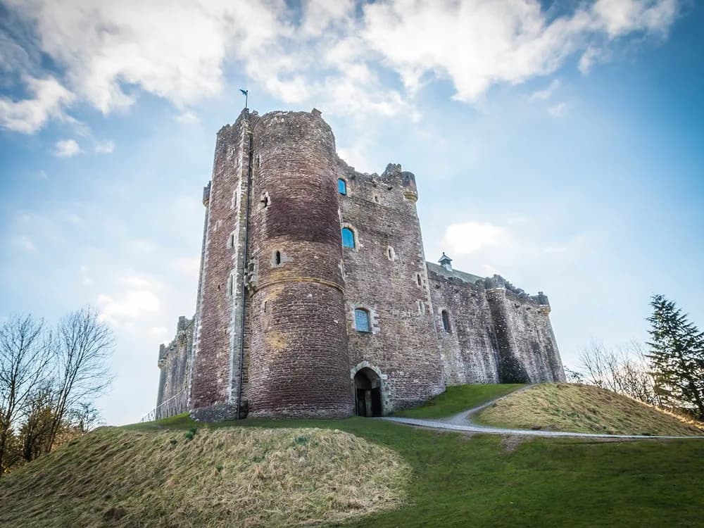 Doune Castle rising above the River Teith in the Scottish Highlands — Castle Leoch in Outlander