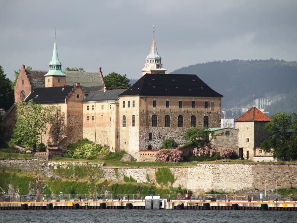 Akershus Fortress at dusk above the Oslo Fjord, Norway