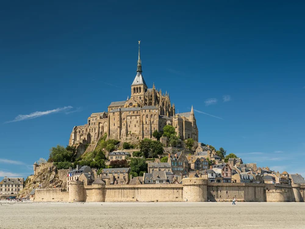 Mont-Saint-Michel rising from the tidal bay at dawn, Normandy France