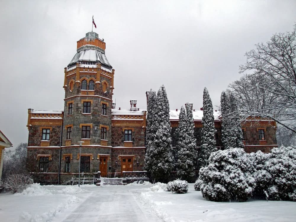 Turaida Castle's red-brick medieval tower above the forested Gauja Valley, Latvia
