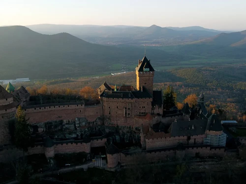 Haut-Kœnigsbourg Castle rising above the Alsace vineyards in autumn