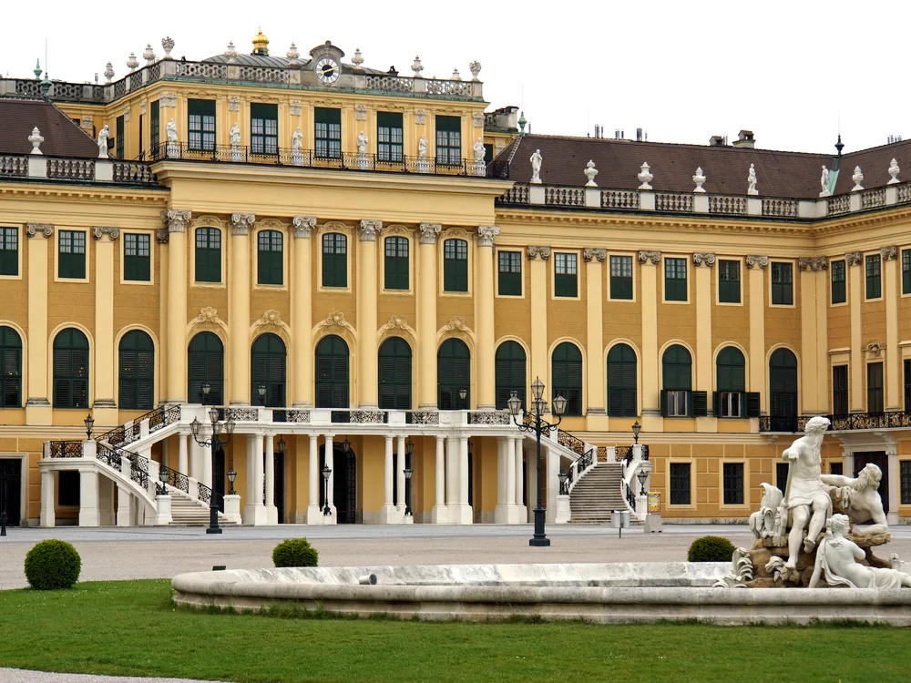 Schönbrunn Palace in Vienna from the Gloriette, with formal gardens stretching toward the ochre Baroque facade